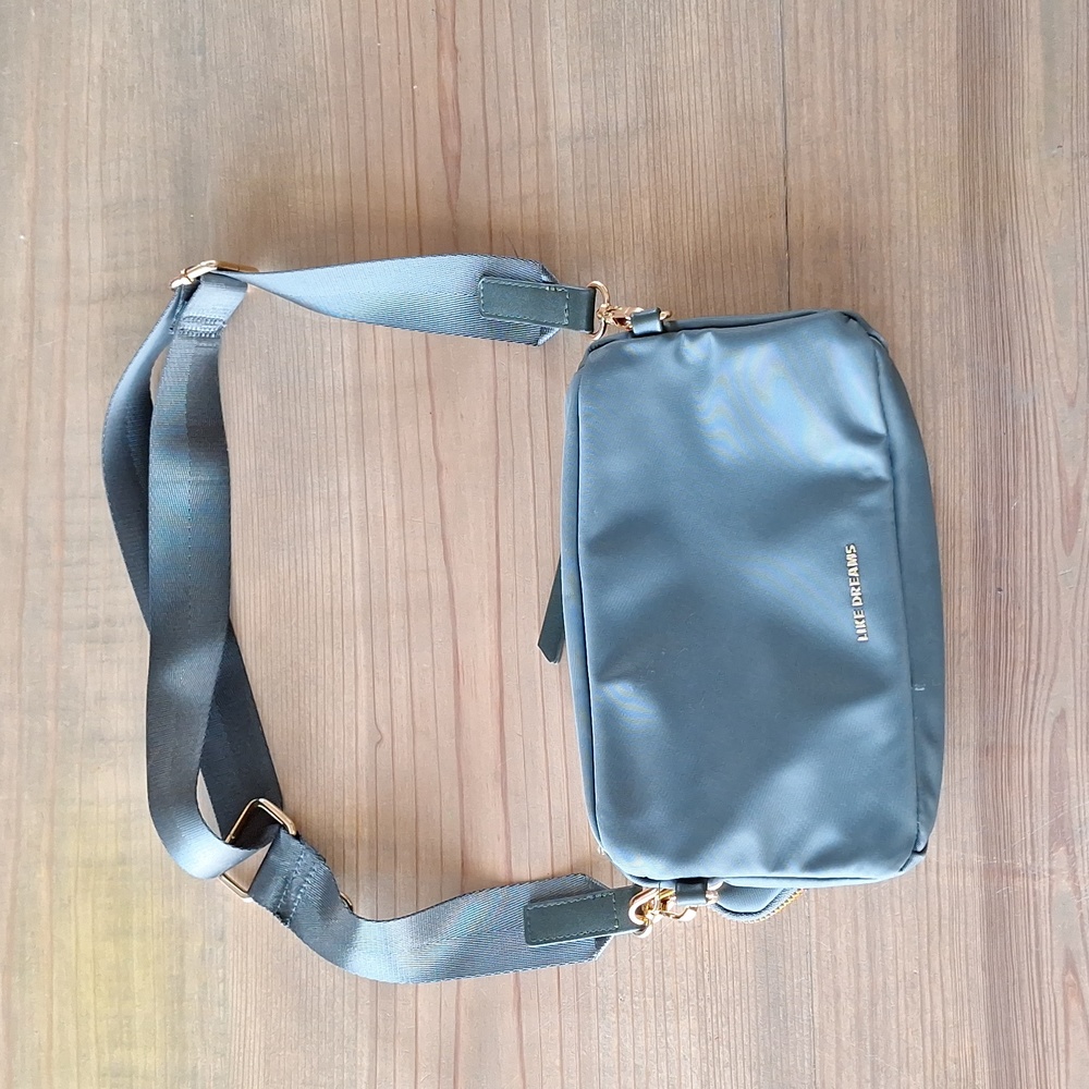 Dark grey fanny pack/crossbody bag.